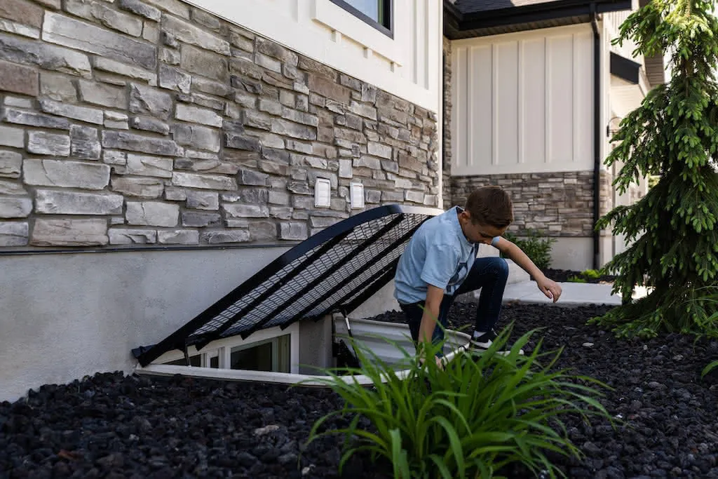 Custom Steel Window Well Cover with EZ Lift System - Mountainland Covers 